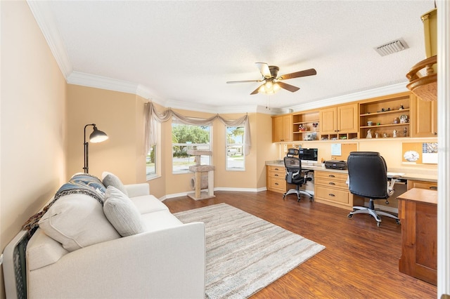616 Hartford Ln, The Villages, FL 32162 - office space featuring ceiling fan, built in study area, ornamental molding, dark wood-style flooring, and baseboards