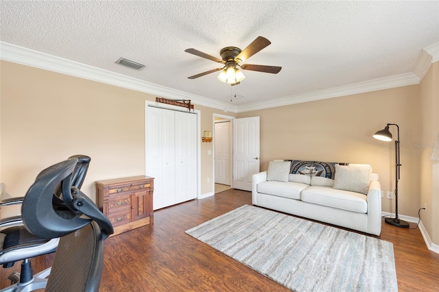 616 Hartford Ln, The Villages, FL 32162 - living room with a ceiling fan, crown molding, wood finished floors, baseboards, and a textured ceiling