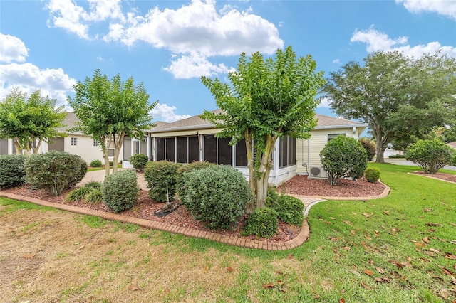 616 Hartford Ln, The Villages, FL 32162 - back of property with a sunroom, a yard, and a cooling unit