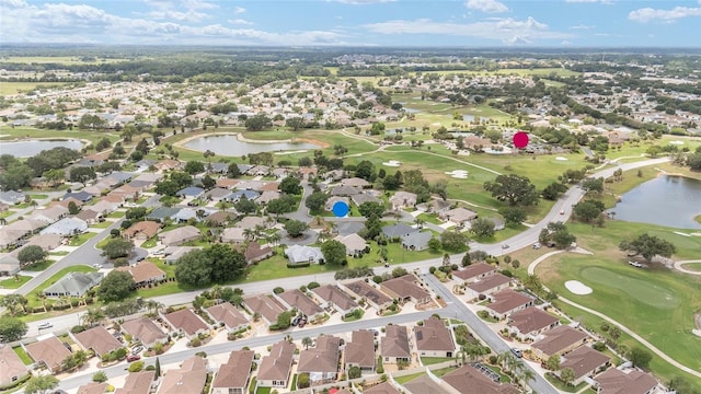 616 Hartford Ln, The Villages, FL 32162 - aerial view of property's location with a large body of water, nearby suburban area, and a golf course