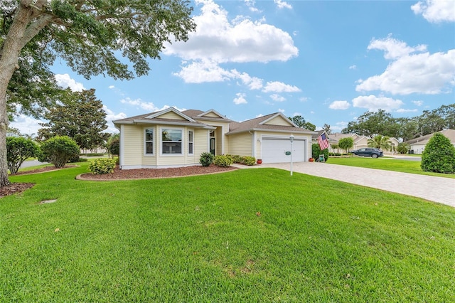 616 Hartford Ln, The Villages, FL 32162 - ranch-style house with driveway, a garage, and a front lawn