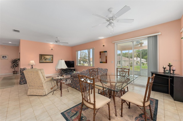 12687 SE 90th Ter, Summerfield, FL 34491 - dining room with ceiling fan, light tile patterned floors, and baseboards