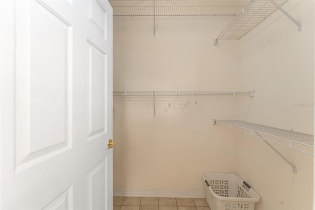 12687 SE 90th Ter, Summerfield, FL 34491 - walk in closet featuring light tile patterned floors