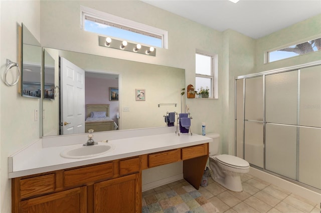 12687 SE 90th Ter, Summerfield, FL 34491 - ensuite bathroom featuring a shower stall, toilet, vanity, and tile patterned floors