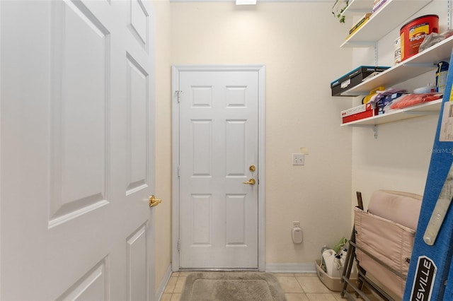 12687 SE 90th Ter, Summerfield, FL 34491 - entryway with light tile patterned floors and baseboards