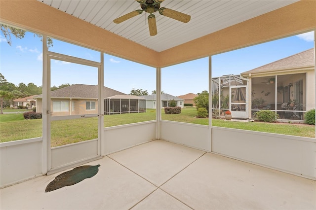 12687 SE 90th Ter, Summerfield, FL 34491 - unfurnished sunroom featuring ceiling fan, plenty of natural light, and a residential view