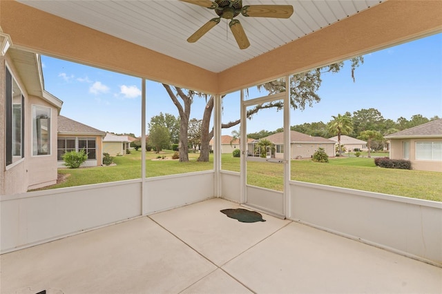 12687 SE 90th Ter, Summerfield, FL 34491 - unfurnished sunroom with a ceiling fan and a residential view
