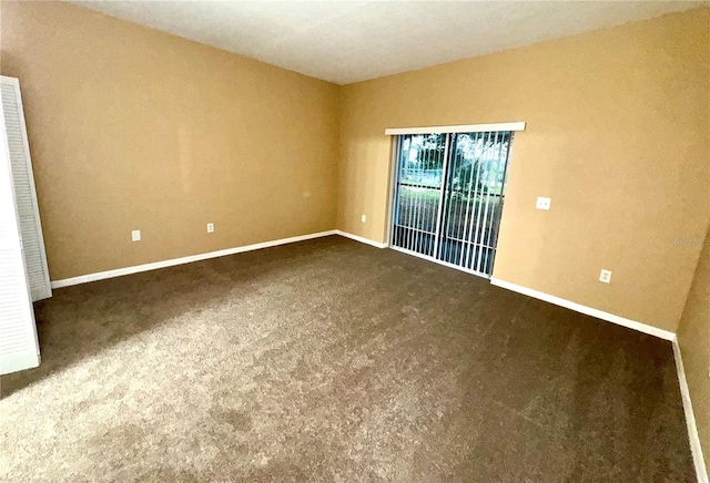spare room with carpet flooring and baseboards