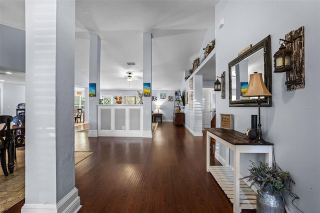 foyer featuring a ceiling fan, wood finished floors, stairway, and baseboards