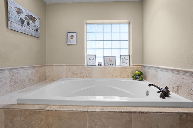 bathroom with a garden tub