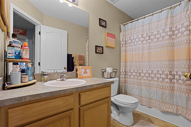bathroom featuring tile patterned floors, a textured ceiling, toilet, vanity, and shower / bath combination with curtain