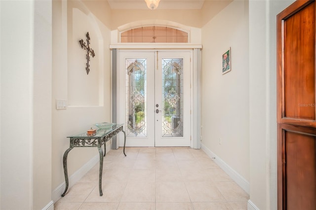 537 Montage Ln, Kissimmee, FL 34759 - foyer entrance with french doors, baseboards, and light tile patterned floors