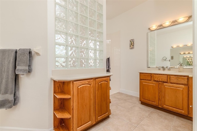 537 Montage Ln, Kissimmee, FL 34759 - full bathroom featuring tile patterned flooring, vanity, and baseboards