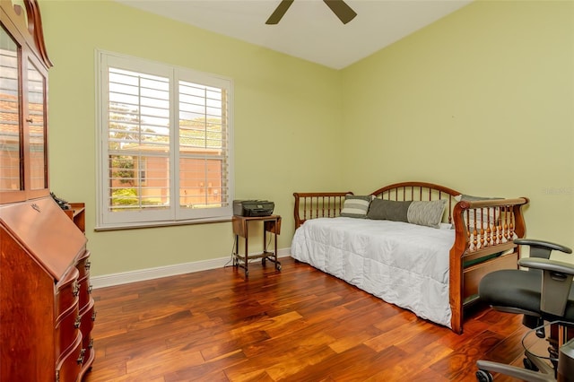 537 Montage Ln, Kissimmee, FL 34759 - bedroom featuring wood finished floors, baseboards, an office area, and ceiling fan