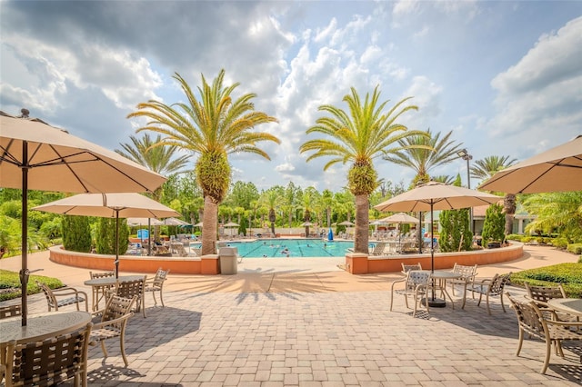 537 Montage Ln, Kissimmee, FL 34759 - community pool featuring a patio