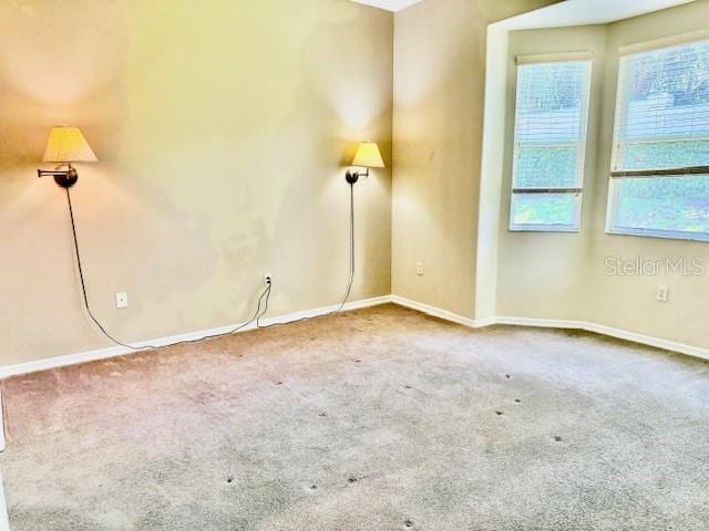 3083 Pinnacle Ct, Clermont, FL 34711 - empty room featuring carpet flooring and baseboards