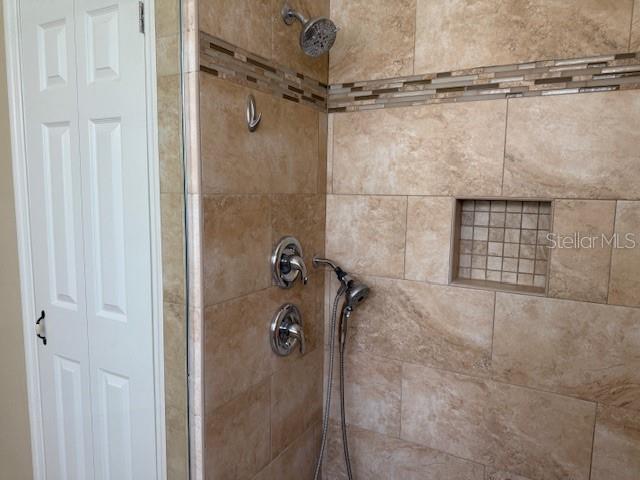 3083 Pinnacle Ct, Clermont, FL 34711 - bathroom view of a shower stall and a closet