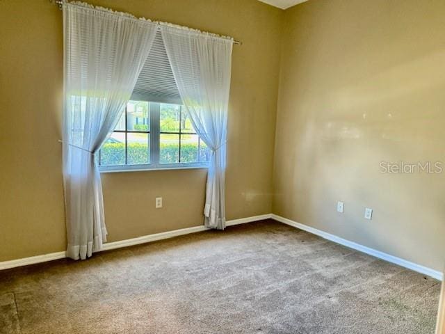 3083 Pinnacle Ct, Clermont, FL 34711 - empty room featuring carpet flooring and baseboards
