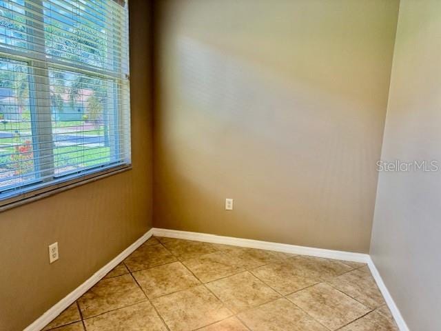 3083 Pinnacle Ct, Clermont, FL 34711 - unfurnished room featuring healthy amount of natural light and light tile patterned floors