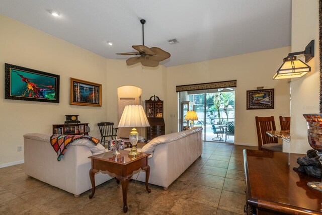 3141 Brighton Rd, Eustis, FL 32726 - tiled living area with a ceiling fan, baseboards, and arched walkways