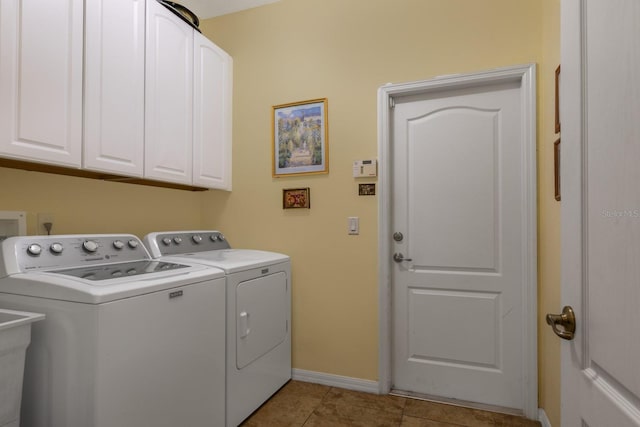 3141 Brighton Rd, Eustis, FL 32726 - laundry room with washer and clothes dryer, cabinet space, baseboards, and light tile patterned flooring