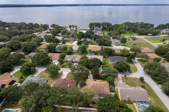 3141 Brighton Rd, Eustis, FL 32726 - aerial perspective of suburban area with property boundaries highlighted and a large body of water