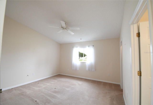 unfurnished bedroom with light carpet, baseboards, and a ceiling fan