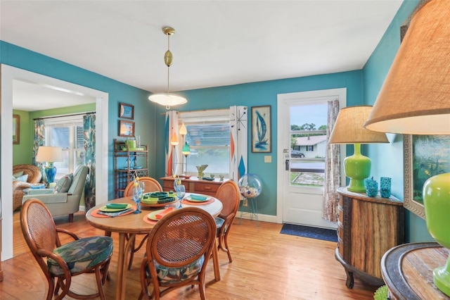 1301 N Ave, Tavares, FL 32778 - dining space featuring light wood finished floors and baseboards