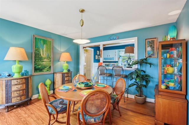 1301 N Ave, Tavares, FL 32778 - dining space featuring wood finished floors and baseboards