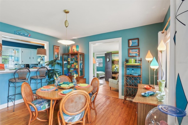 1301 N Ave, Tavares, FL 32778 - dining room featuring wood finished floors and baseboards