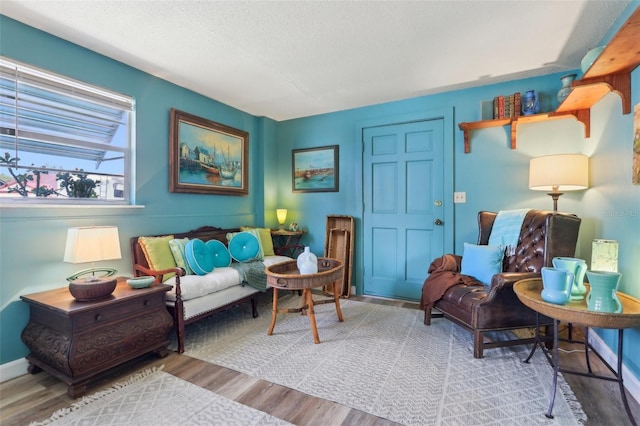 1301 N Ave, Tavares, FL 32778 - living area featuring wood finished floors and a textured ceiling
