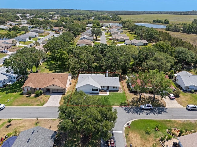 aerial perspective of suburban area featuring property parcel outlined and a large body of water
