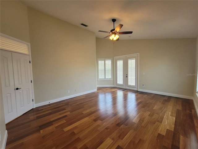 8719 Kenmure Cv, Orlando, FL 32836 - unfurnished room featuring dark wood finished floors, ceiling fan, baseboards, french doors, and high vaulted ceiling