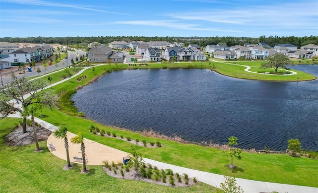 aerial view of residential area with a nearby body of water