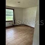 2826 Crk 610, Bushnell, FL 33513 - spare room featuring wood finished floors