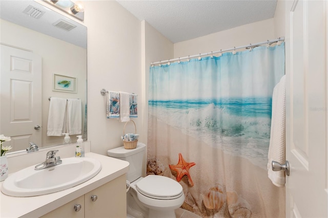 full bath featuring vanity, toilet, a textured ceiling, and a shower with curtain