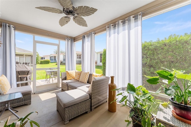 sunroom with a ceiling fan