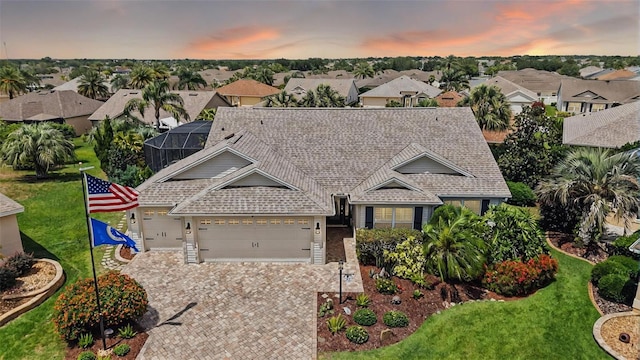 1053 Alcove Loop, The Villages, FL 32162 - view of front of property featuring a residential view, a garage, driveway, and a lawn