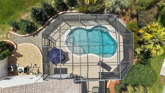 1053 Alcove Loop, The Villages, FL 32162 - swimming pool with a patio area and glass enclosure