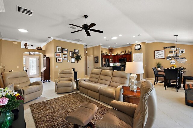 1053 Alcove Loop, The Villages, FL 32162 - living area with ceiling fan, light tile patterned floors, arched walkways, vaulted ceiling, and recessed lighting