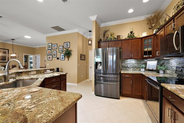 1053 Alcove Loop, The Villages, FL 32162 - kitchen featuring stainless steel refrigerator with ice dispenser, electric range, a sink, decorative backsplash, and light tile patterned floors