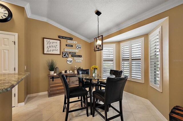 1053 Alcove Loop, The Villages, FL 32162 - dining room featuring light tile patterned floors, crown molding, lofted ceiling, baseboards, and a chandelier