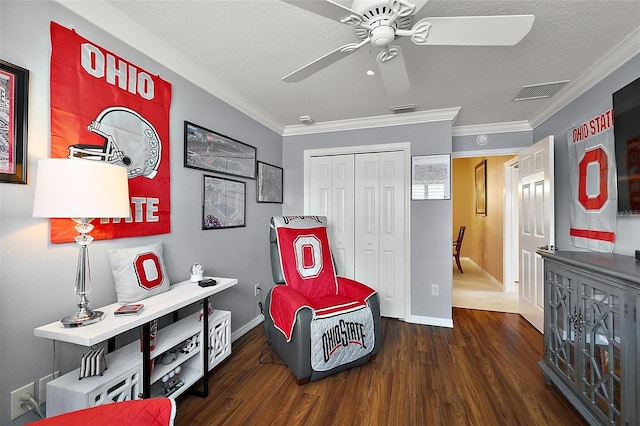 1053 Alcove Loop, The Villages, FL 32162 - rec room featuring a ceiling fan, a textured ceiling, wood finished floors, ornamental molding, and baseboards