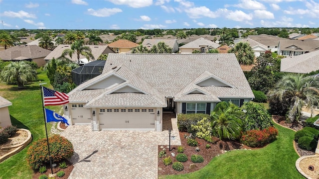 1053 Alcove Loop, The Villages, FL 32162 - view of front facade featuring a residential view, an attached garage, driveway, and a front yard