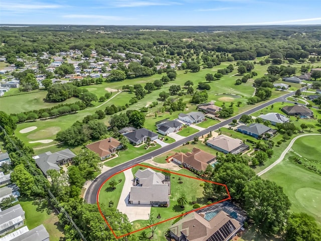 563 Dowling Cir, Lady Lake, FL 32159 - aerial perspective of suburban area with a golf club and property parcel outlined