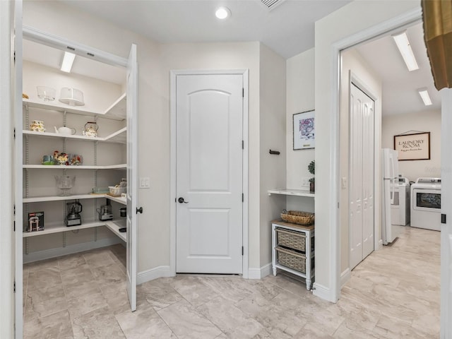 563 Dowling Cir, Lady Lake, FL 32159 - storage area featuring independent washer and dryer