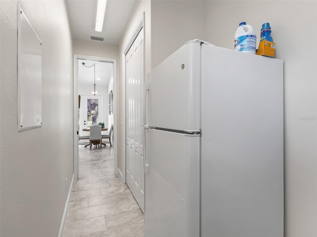 563 Dowling Cir, Lady Lake, FL 32159 - hall featuring baseboards