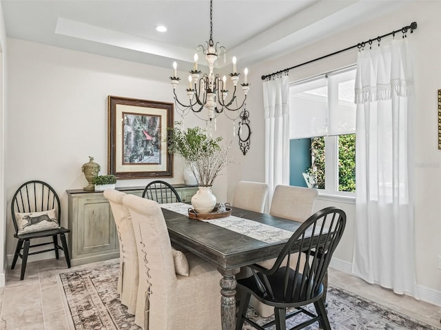 563 Dowling Cir, Lady Lake, FL 32159 - dining space with a chandelier, a tray ceiling, baseboards, and recessed lighting