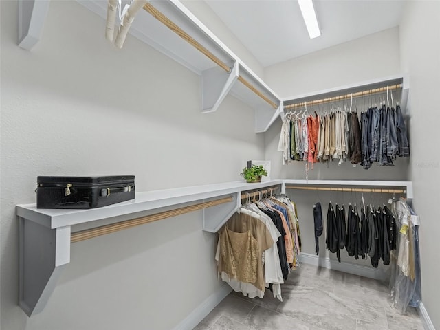563 Dowling Cir, Lady Lake, FL 32159 - walk in closet featuring marble finish floors