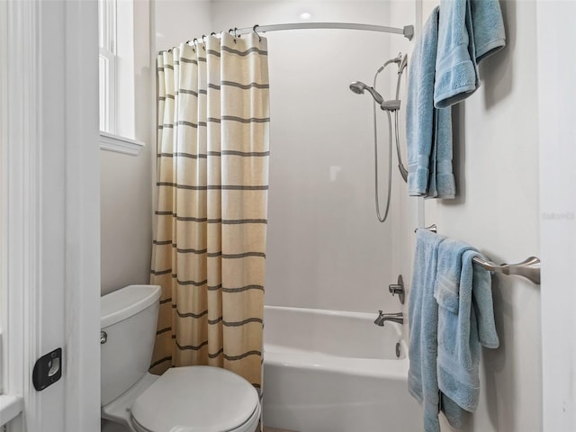 563 Dowling Cir, Lady Lake, FL 32159 - bathroom featuring toilet and shower / tub combo